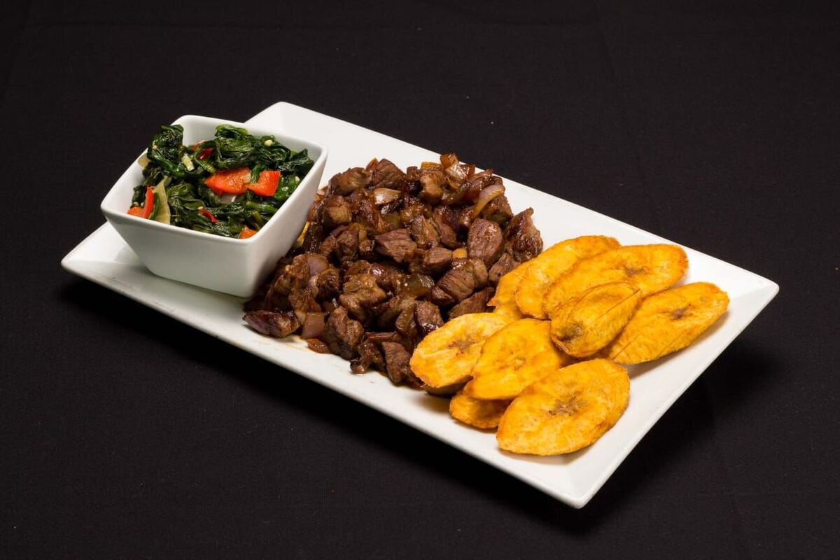 Fried Goat — Dry Fry with plantains and sautéed greens