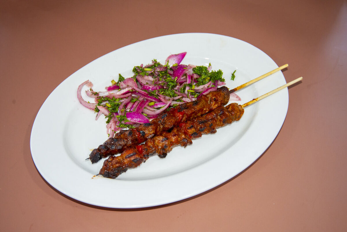 Goat brochettes — slow-grilled over open fire